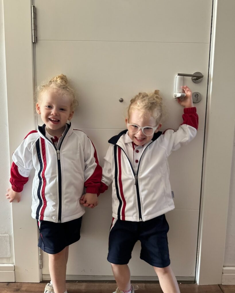 The girls wearing their uniforms for their first day of school in Spain