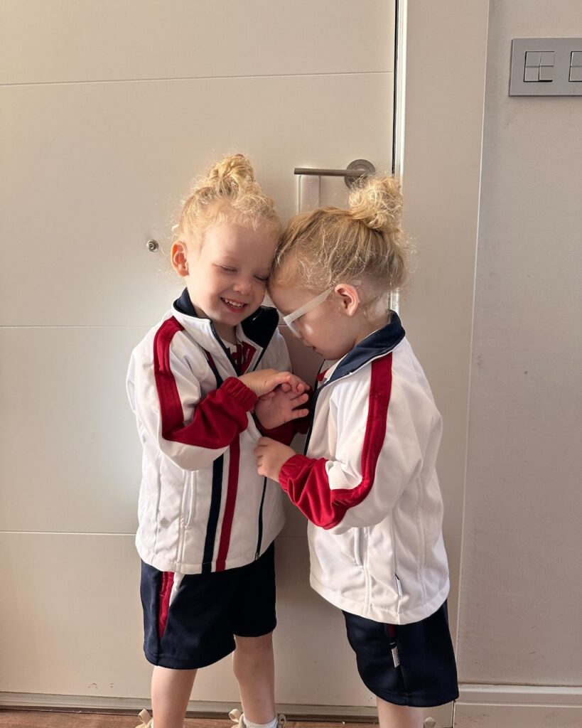 The girls wearing their uniforms for their first day of school in Spain